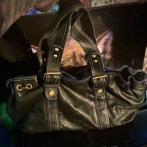 Daniel black leather small baguette hand shoulder bag. Black whit stitching